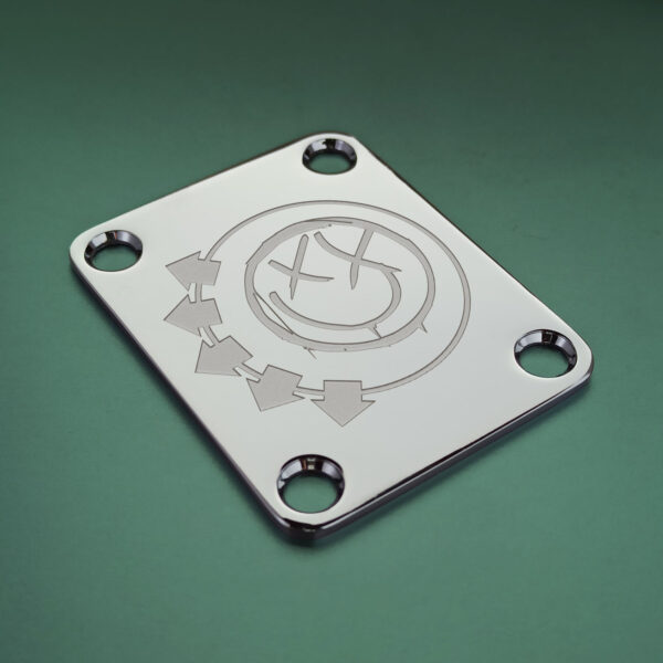 Chrome guitar neck plate with deep laser engraving of Blink-182 2002 smiley logo, compatible with Fender, Squier, Mustang, Jaguar, Starcaster, and Cyclone guitars – Blaudez Guitars