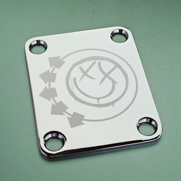 Chrome guitar neck plate with deep laser engraving of Blink-182 2002 smiley logo, compatible with Fender, Squier, Mustang, Jaguar, Starcaster, and Cyclone guitars – Blaudez Guitars